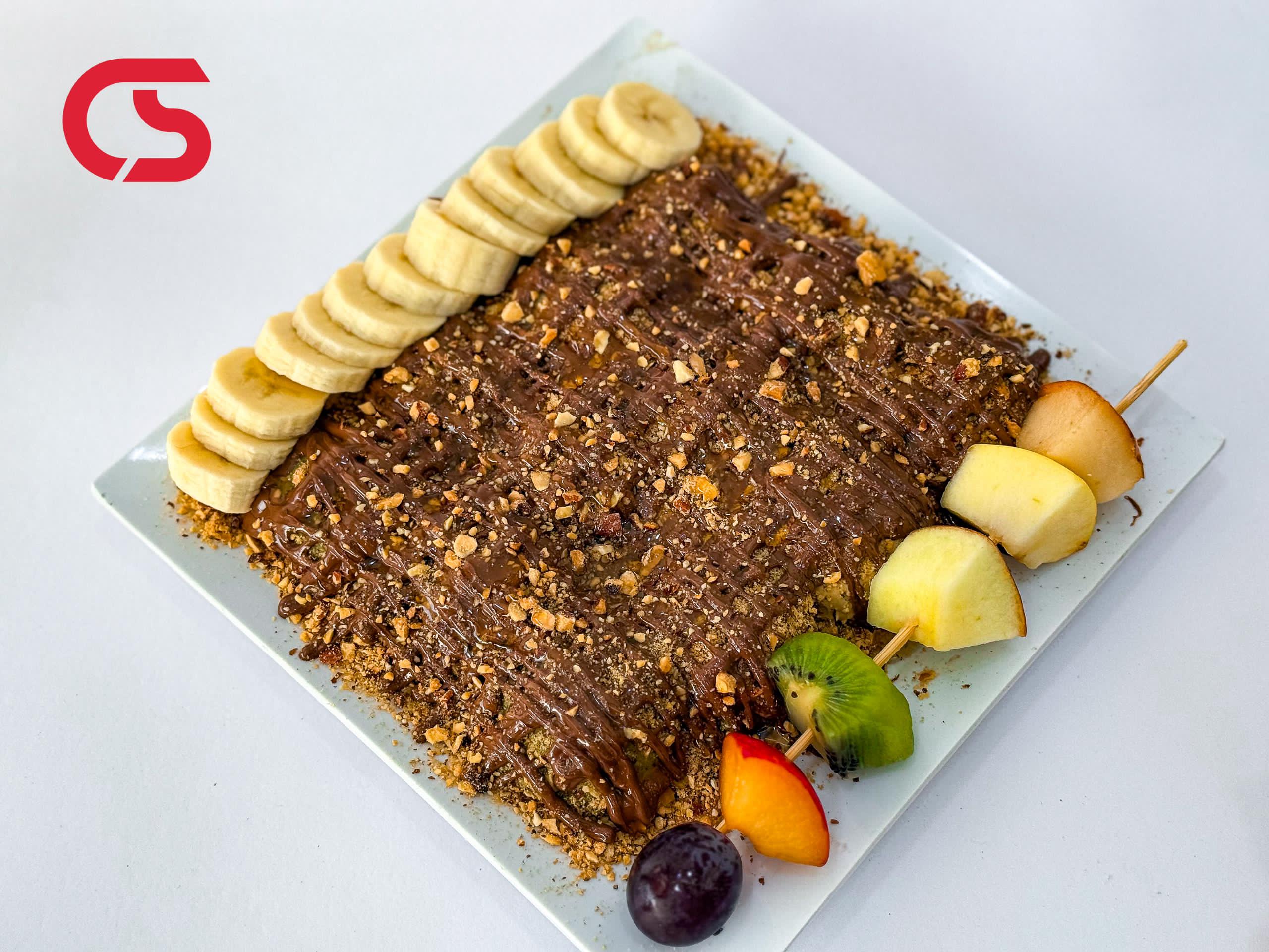 Nutella, honey, nuts, and fruits crepe