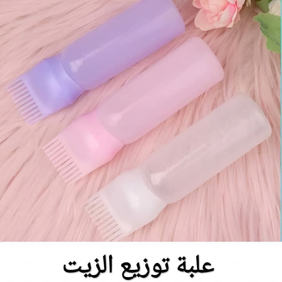 علبة توزيع الزيت على الشعر